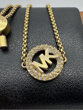 Michael Kors Gold-Tone Crystal MK Circle Pendant Necklace